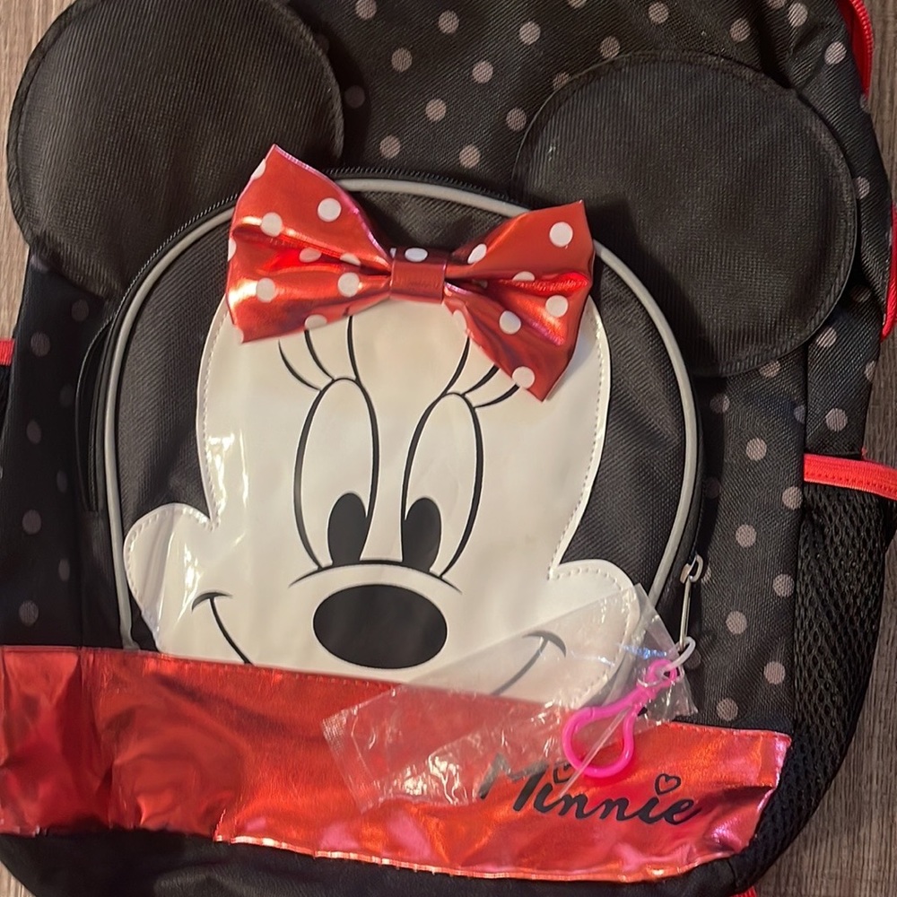 Like New (never used) Minnie full size backpack. Measures approx 19 inches long.